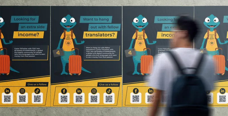 Translation Nomads poster campaign on a city wall